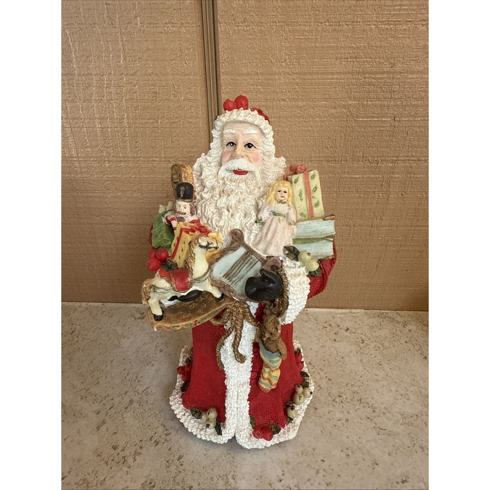 Vtg Resin Santa Claus Holding Toys Musical Instruments Book Holly Berry Figurine